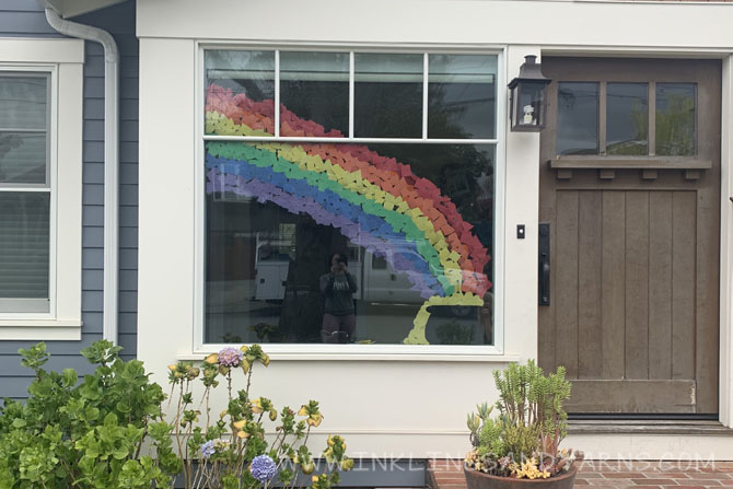 Window decoration of a rainbow and pot of gold, made with construction paper