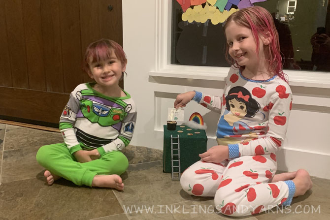 2 young children showing off a leprechaun trap.